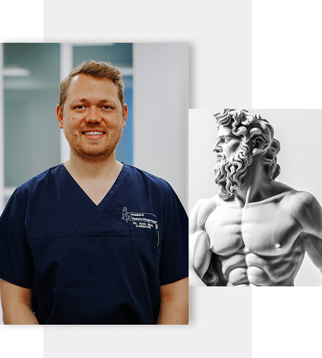 Mann in medizinischer Kleidung vor einer Statue